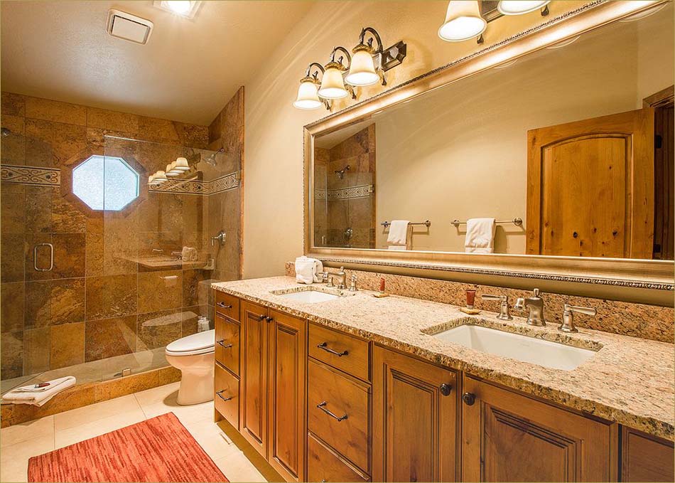 Private en suite bathroom in the master suite includes twin vanities and basins plus a walk-in shower.